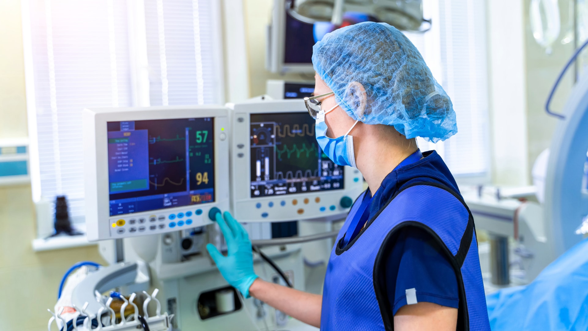 Doctor using a computer during a procedure